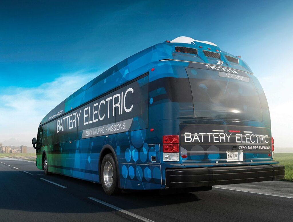 A blue Proterra bus with "battery electric" written on the side