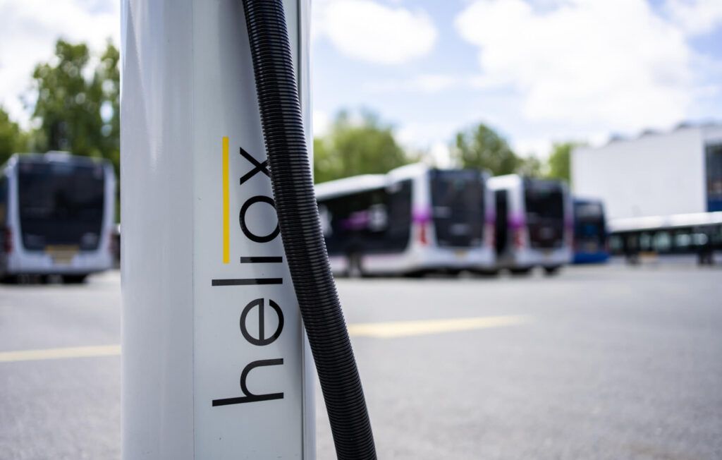 Heliox charger with electric buses in the background