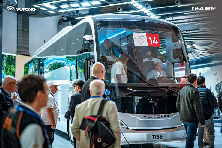 The Yutong T15E bus at busworld. Guests are exploring the interior