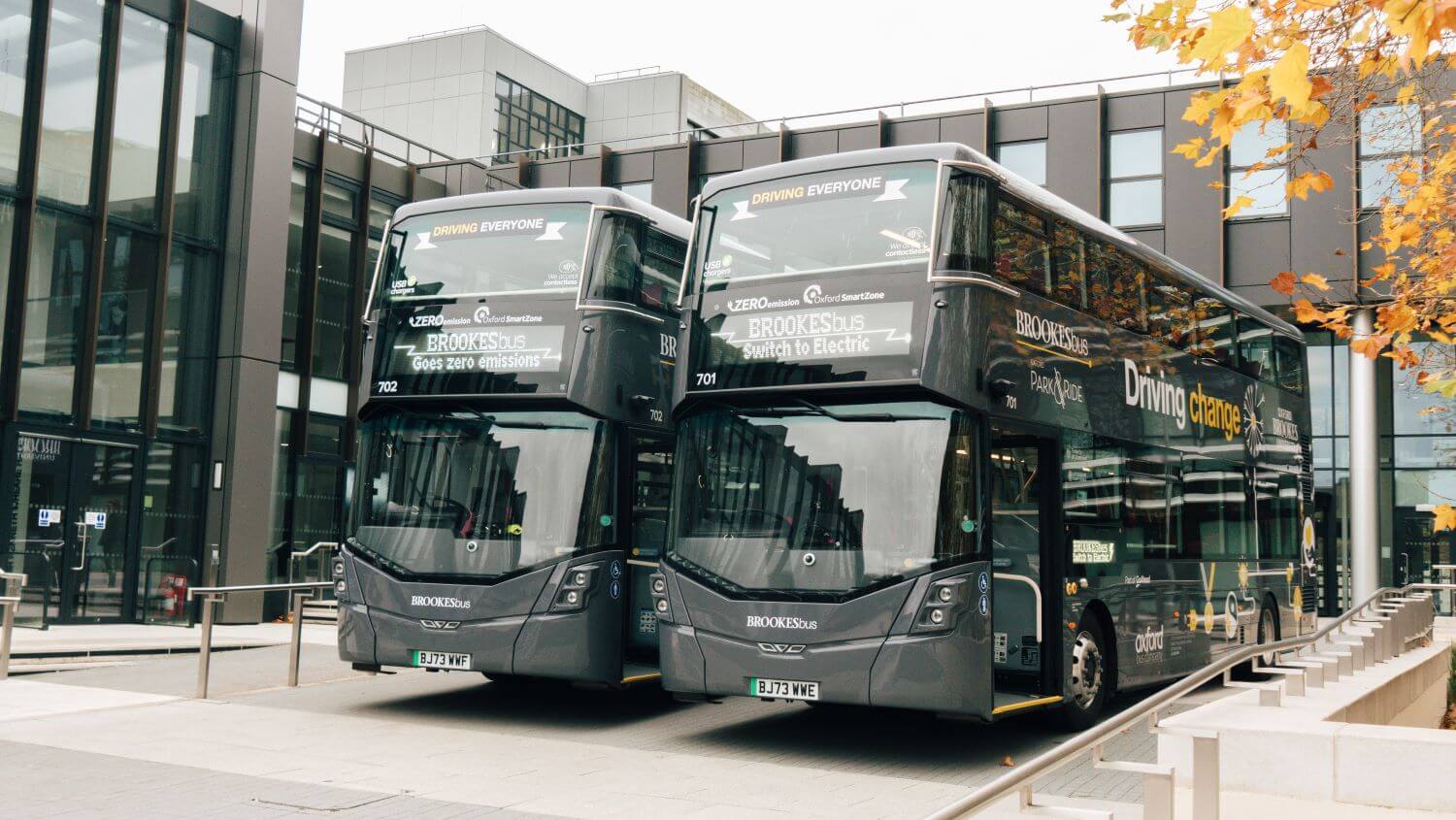 Two Wrightbus electric buses outside a bus station