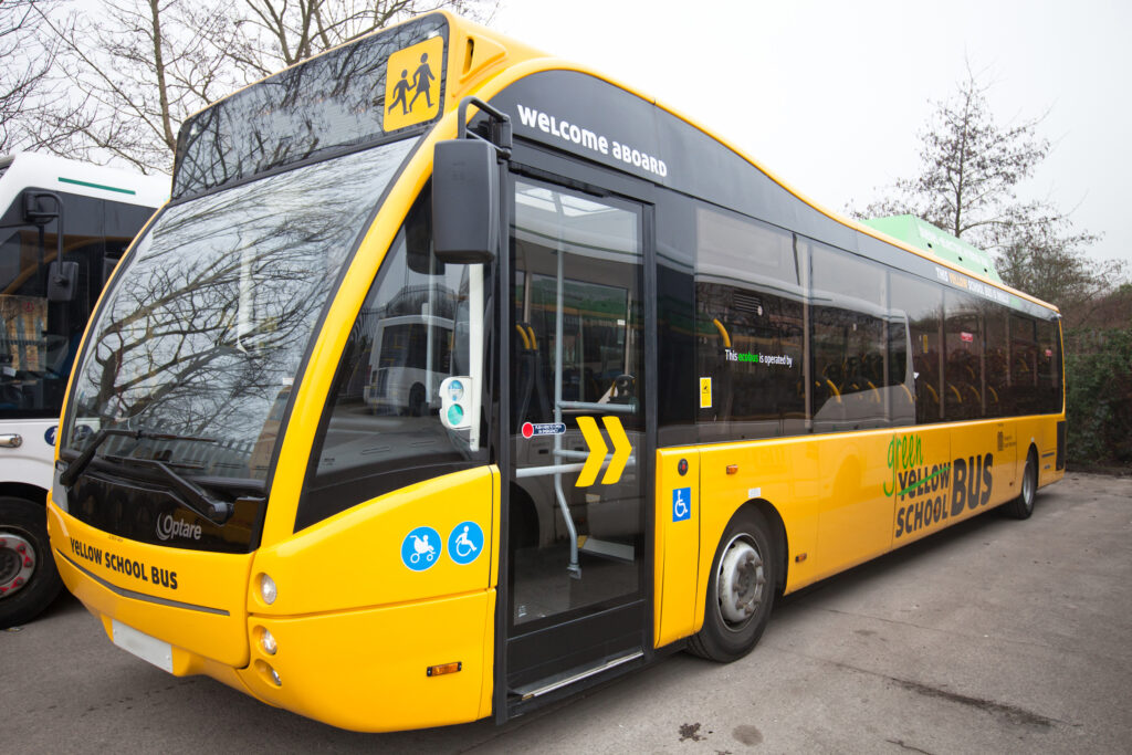 A yellow, Bee Network school bus