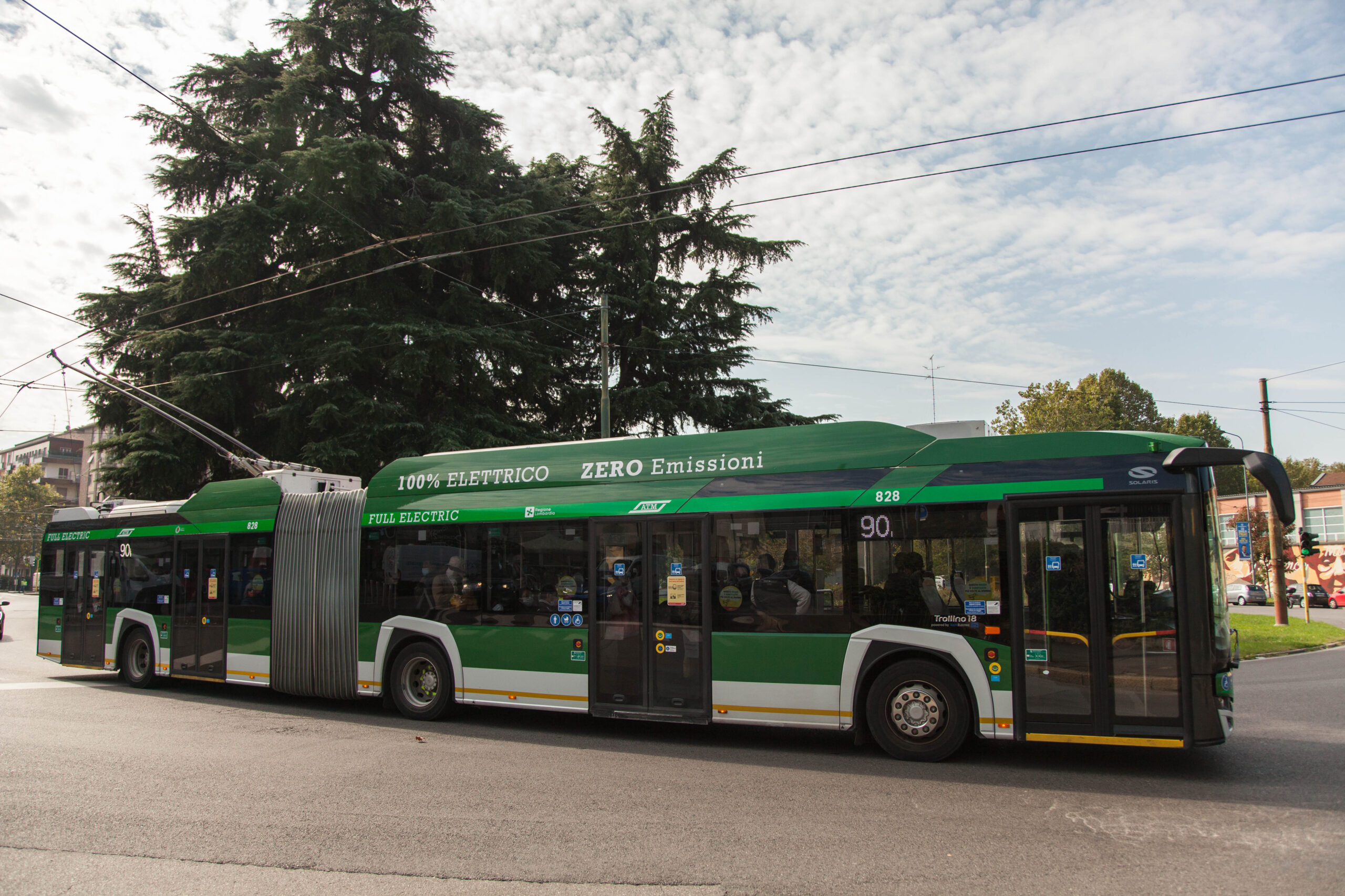 A predominantly green bus