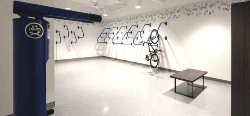 A white room with wall hanging bike storage