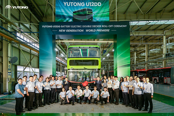 An image of Yutong workers celebrating the launch of their U12DD battery electric double decker bus