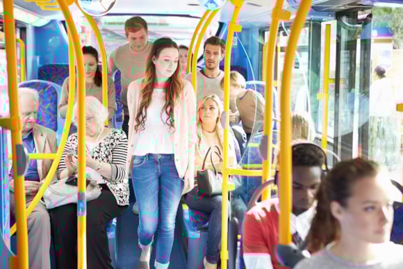 A group of people on a crowded bus