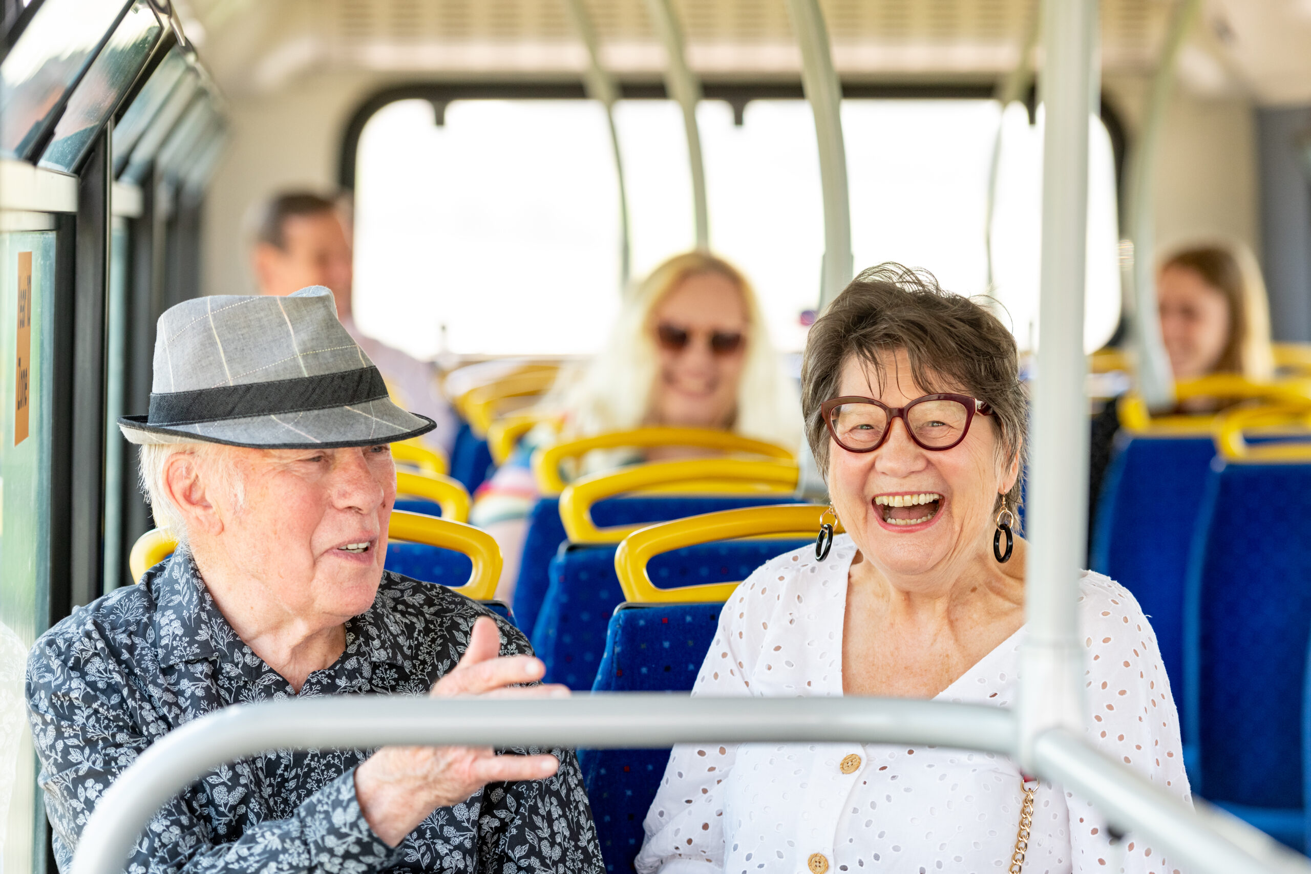 People laughing on a bus