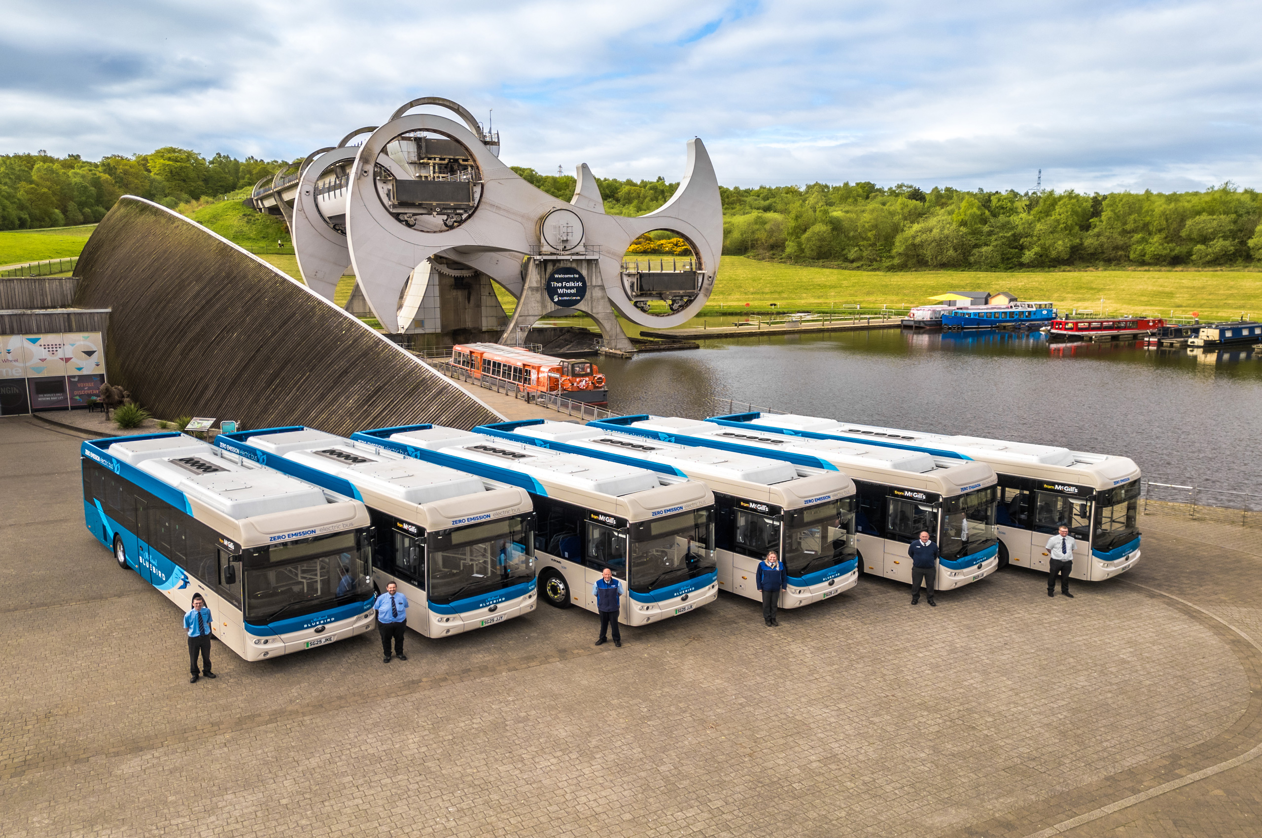 A row of buses lined up by the Falkirk Wheel in Scotland