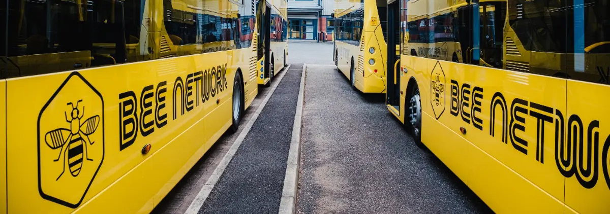 Two Bee Network buses side-by-side