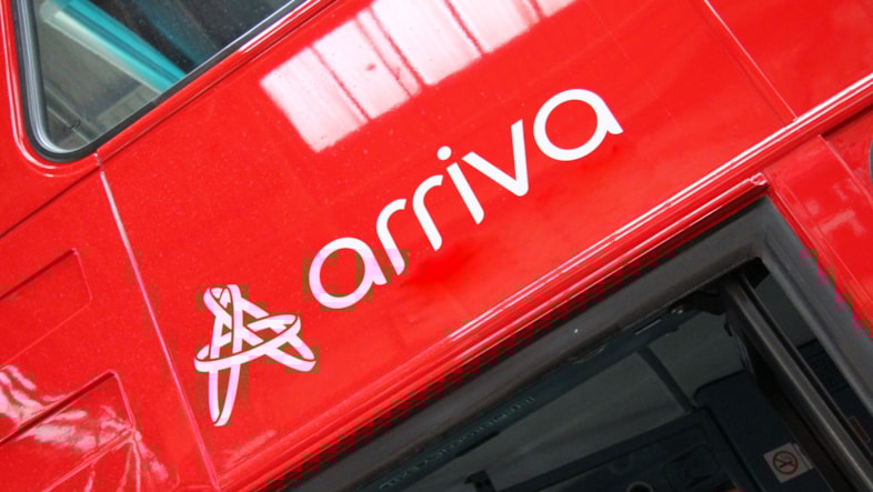 The Arriva Group logo on a red bus