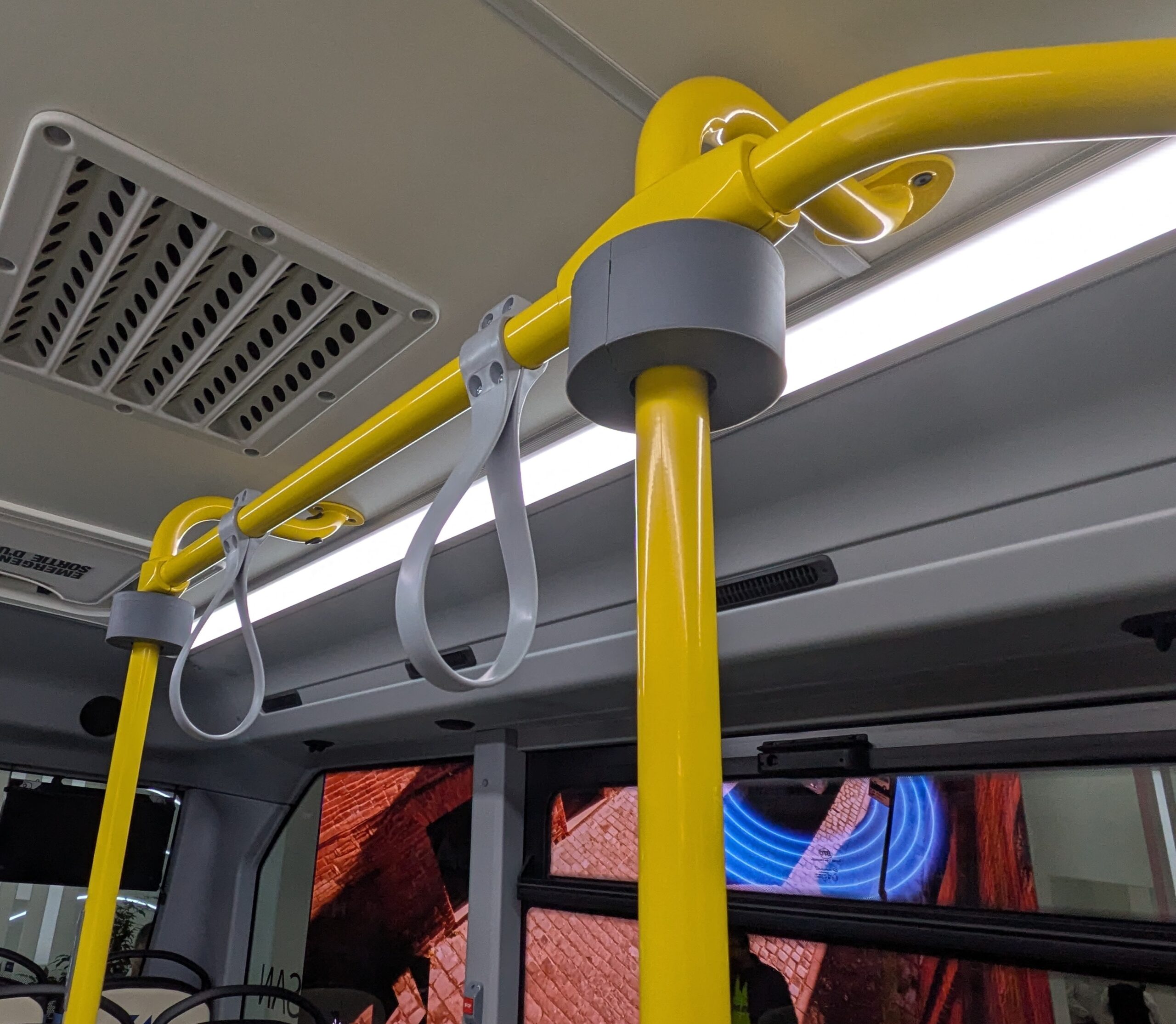 The grey component moves up and down the pole to self-clean the area