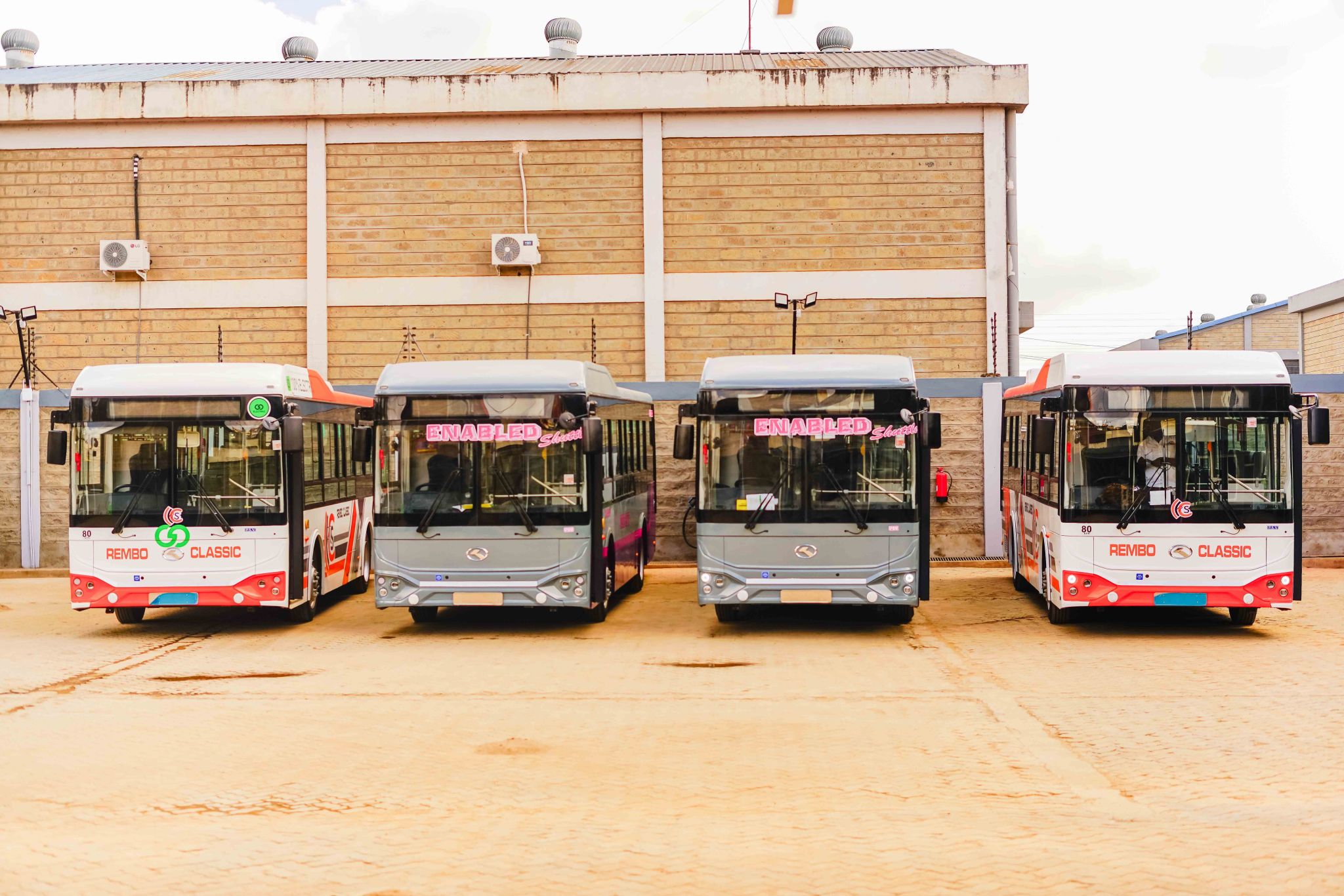 A lineup of four buses