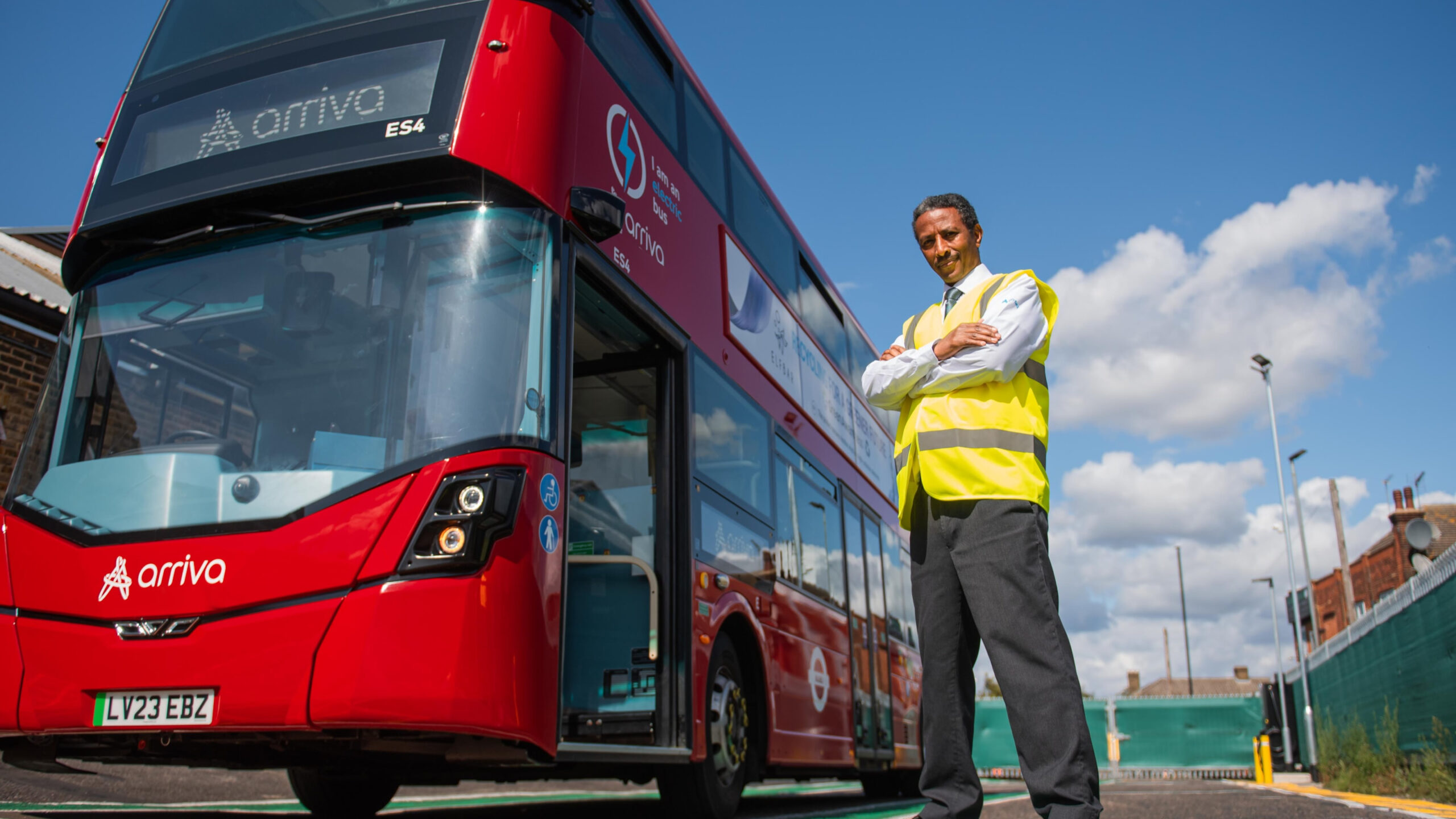 A man stood by a bus
