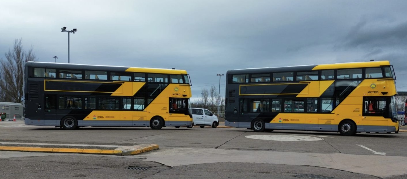 Yellow, grey and black buses