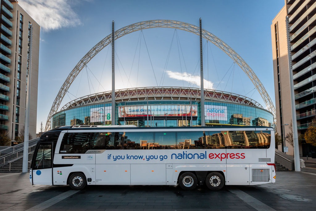 A National Express coach in front of Wembley Stadium