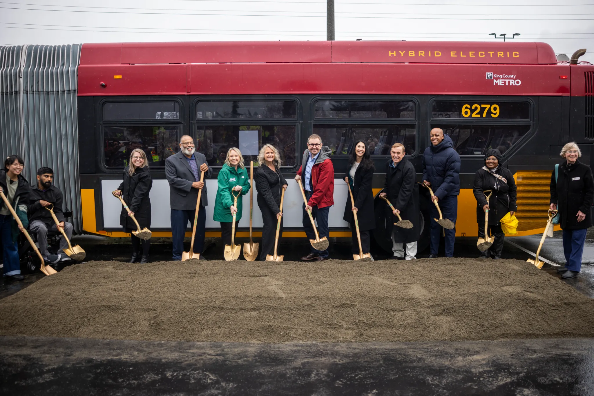 (Left to right) Community members Arya Nguyen and Prem Subedi, Metro General Manager Michelle Allison, State Rep. David Hackney, Auburn Deputy Mayor Tracy Taylor, Kent Mayor Dana Ralph, Renton Mayor Armondo Pavone, King County Councilmembers Steffani Fain & Peter von Reichbauer, King County Executive Girmay Zahilay, State Rep. Debra Entenman, Renton Councilmember Valerie O’Halloran