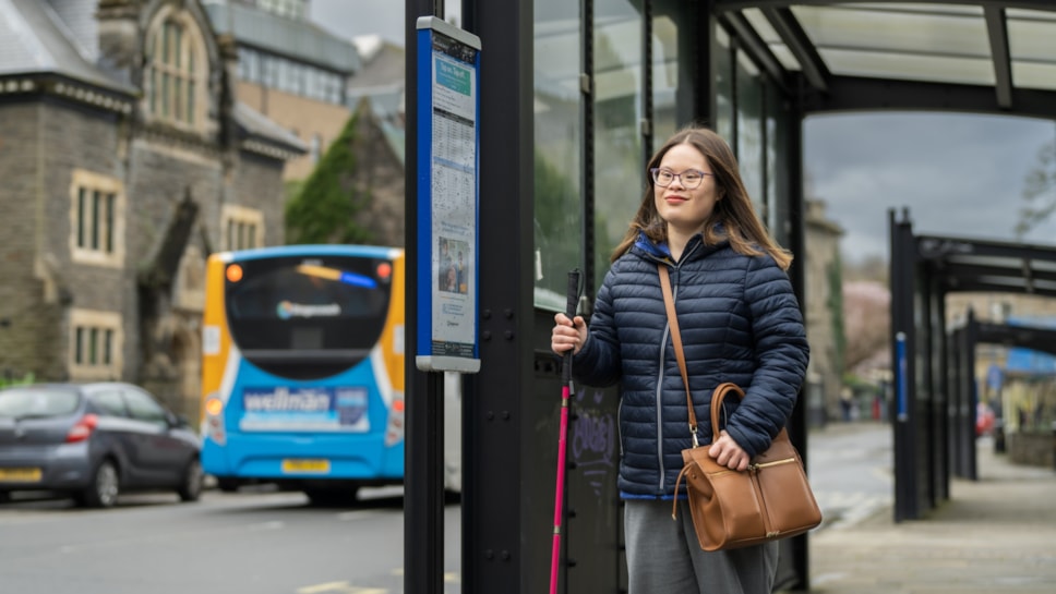 A woman waiting for a bus