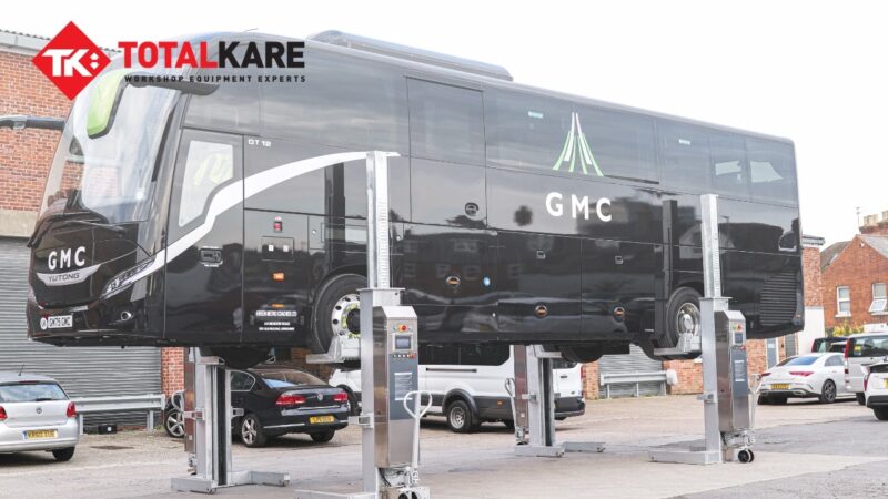 Green Metro Coach being lifted up by Totalkare lifting equipment