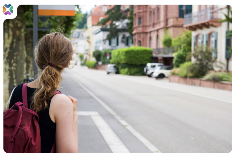 Girl waiting at bus stop