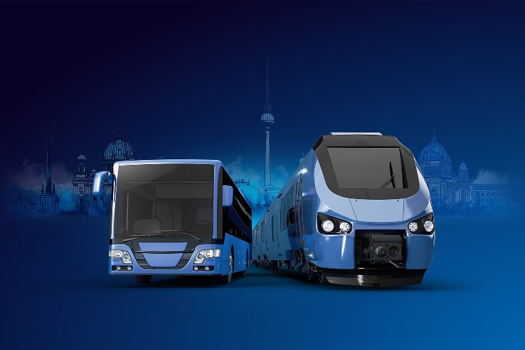 "Illustration of a blue bus and a blue train side by side against a dark blue Berlin skyline featuring the TV Tower and city landmarks"